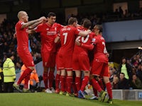  Liverpool players celebrate their team's first goal scored by Eliaquim Mangala of Manchester City during the Barclays Premier League match between Manchester City and Liverpool at Etihad Stadium on November 21, 2015 in Manchester, England. 