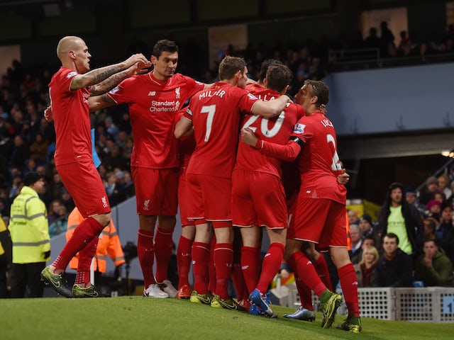  Liverpool players celebrate their team's first goal scored by Eliaquim Mangala of Manchester City during the Barclays Premier League match between Manchester City and Liverpool at Etihad Stadium on November 21, 2015 in Manchester, England. 