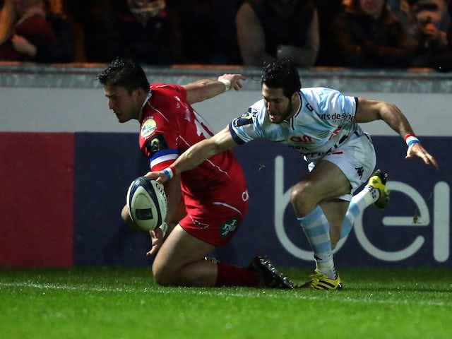  Maxime Machenaud of Racing 92 pounces on a loose ball ahead of Scarlets DTH Van Der Merwe to score a try during the European Rugby Champions Cup match between Scarlets and Racing 92 at the Parc y Scarlets on November 21, 2015 in Llanelli, Wales.