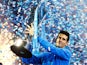 Novak Djokovic of Serbia lifts the trophy following his victory during the men's singles final against Roger Federer of Switzerland on day eight of the Barclays ATP World Tour Finals at the O2 Arena on November 22, 2015