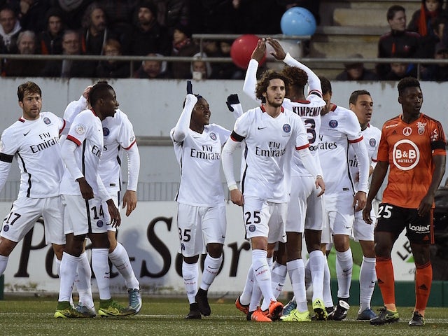 Paris Saint Germain players celebrate after a goal during the French L1 football match Lorient against Paris Saint Germain on November 21, 2015 at the Moustoir stadium in Lorient, western France. 