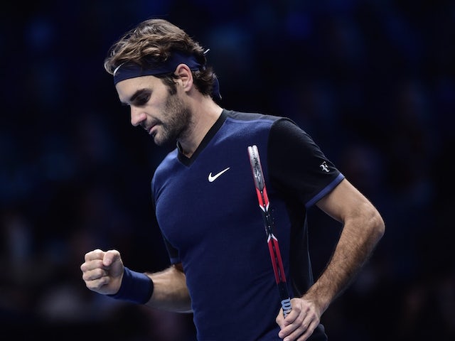 Switzerland's Roger Federer wins a point against Switzerland's Stan Wawrinka during the men's singles semi-final match on day seven of the ATP World Tour Finals tennis tournament in London on November 21, 2015.