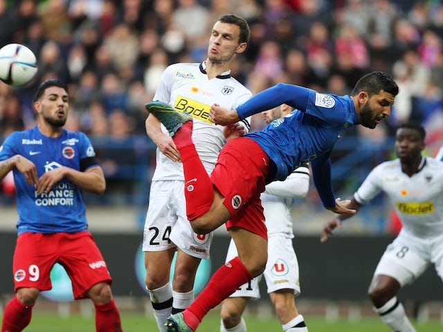 Angers' French defender Romain Thomas (L) vies for the ball with Caen's French defender Syam Ben Youssef during the French L1 football match between Caen (SM Caen) and Angers (SCO Angers), on November 22, 2015, at the Michel d'Ornano stadium, in Caen, nor