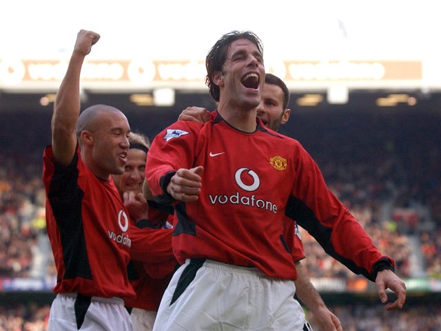 Manchester United's Ruud van Nistelrooy celebrates after scoring his hat trick (3 goals) against Newcastle City during their Premiership clash at Old Trafford in Manchester 23 November 2002