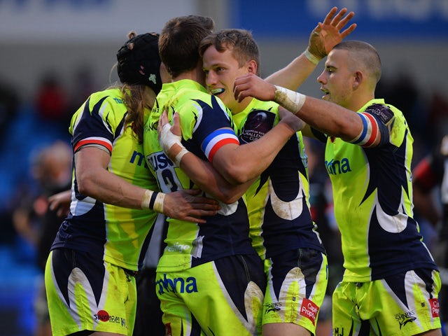 Sam James of Sale Sharks is congratulated after scoring a try by his team mates during the European Rugby Challenge Cup match between Sale Sharks and Pau at AJ Bell Stadium on November 21, 2015