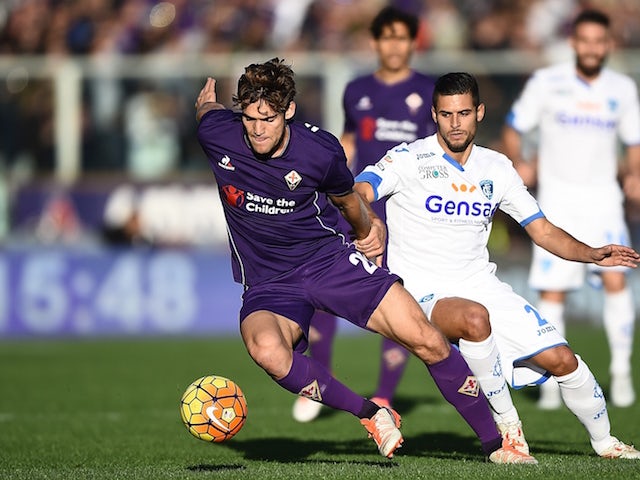 Empoli's defender from France Vincent Laurini vies with Fiorentina's defender from Spain Marcos Alonso Mendoza (L) during the Italian Serie A football match Fiorentina vs Empoli at the Artemio Franchi Stadium on November 22, 2015 in Florence.