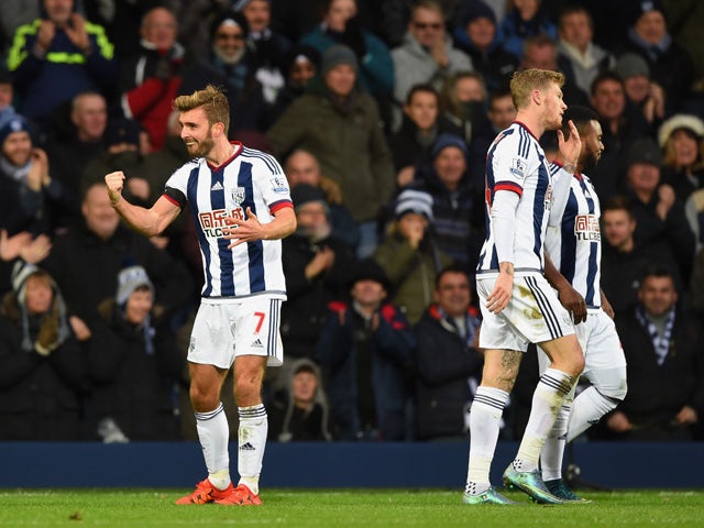 James Morrison (L) of West Bromwich Albion celebrates scoring his team's first goal during the Barclays Premier League match between West Bromwich Albion and Arsenal at The Hawthorns on November 21, 2015