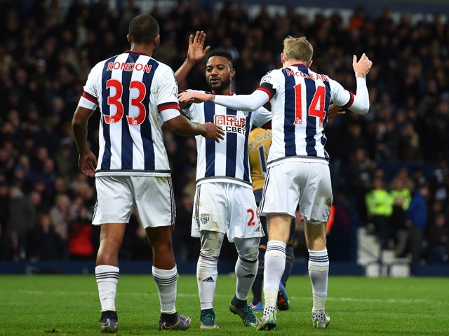 Salomon Rondon, Stephane Sessegnon and James McClean of West Bromwich Albion celebrate their team's second goal scored by Mikel Arteta of Arsenal during the Barclays Premier League match between West Bromwich Albion and Arsenal at The Hawthorns on Novembe