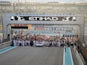 F1 personnel, teams and media mill around on the starting grid before the start of the Abu Dhabi Formula One Grand Prix at the Yas Marina circuit on November 29, 2015.