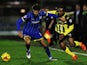 George Francomb of AFC Wimbledon and Ashley Hemmings of Dagenham and Redbridge challenge for the ball during the Sky Bet League Two match between AFC Wimbledon and Dagenham and Redbridge at The Cherry Red Records Stadium on November 24, 2015