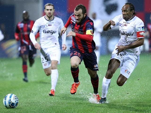 Ajaccio's French midfielder Louis Poggi (C) vies for the ball with Guingamp's French defender Jeremy Sorbon during the French Ligue Cup football match between Gazelec Ajaccio (GFCA) and Guingamp (EAG) on November 25, 2015