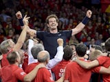 Britain's Andy Murray (C) celebrates with teammates after winning his tennis match against Belgium's David Goffin to win the Davis Cup final between Belgium and Britain at Flanders Expo in Ghent on November 29, 2015