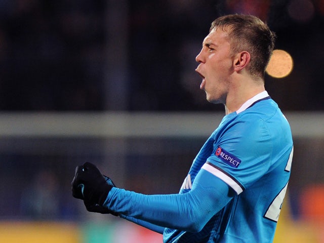Zenit's Russian forward Artem Dzyuba celebrates after scoring a goal during the UEFA Champions League group H football match between FC Zenit and Valencia CF at the Petrovsky stadium in St Petersburg on November 24, 2015