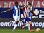 Atletico Madrid's Argentinian forward Luciano Vietto (R) vies with Espanyol's Senegalese midfielder Pape Diop during the Spanish league football match Club Atletico de Madrid vs RCD Espanyol at the Vicente Calderon stadium in Madrid on November 28, 2015.
