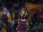Barcelona's defender Gerard Pique celebrates after scoring during the UEFA Champions League Group E football match FC Barcelona vs AS Roma at the Camp Nou stadium in Barcelona on November 24, 2015