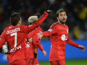 Late own goal rescues point for Leverkusen