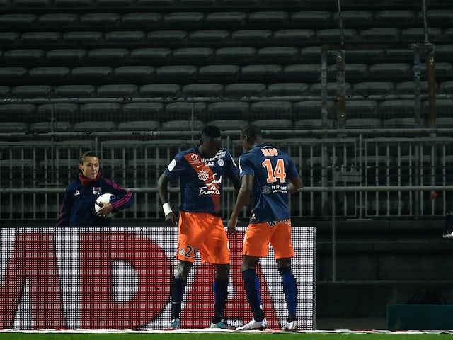 Montpellier's Chadian forward Casimir Ninga (L) celebrates with Montpellier's French midfielder Bryan Dabo after scoring a goal during the French L1 football match between Lyon and Montpellier at the Gerland Stadium in Lyon, central-eastern France, on Nov