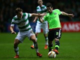 James Forrest of Celtic challenges Amin Younes of Ajax during the UEFA Europa League Group A match between Celtic FC and AFC Ajax on November 26, 2015 in Glasgow, Scotland.