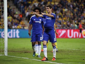 Oscar of Chelsea celebrates scoring his teams third goal during the UEFA Champions League Group G match between Maccabi Tel-Aviv FC and Chelsea FC at Sammy Ofer Stadium on November 24, 2015
