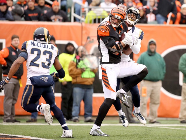 Tyler Eifert #85 of the Cincinnati Bengals makes a catch between Rodney McLeod #23 and Marcus Roberson #47 of the St. Louis Rams at Paul Brown Stadium on November 29, 2015