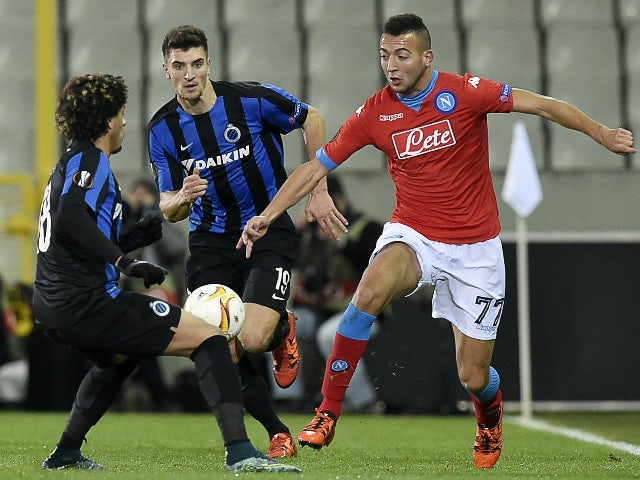 Club Bruggess Felipe Gedoz (L) vies with Napoli's Omar El Kaddouri (R) during the UEFA Europa League Group D football match between Club Brugge and SSC Napoli played behind closed doors at the Jan Breydel stadium in Bruges on November 26