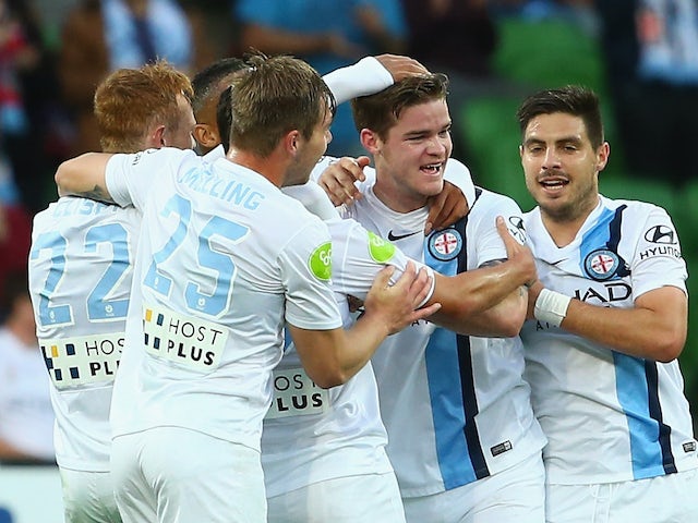 Connor Chapman of Melbourne City celebrates with team mates after scoring a goal during the round eight A-League match between Melbourne City FC and Perth Glory at AAMI Park on November 27, 2015 in Melbourne, Australia.