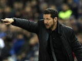 Atletico Madrid's Argentinian coach Diego Simeone gestures during the Spanish league football match Club Atletico de Madrid vs RCD Espanyol at the Vicente Calderon stadium in Madrid on November 28, 2015.