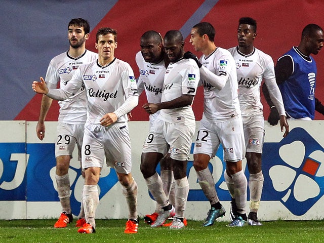 Guingamp's French forward Sloan Privat is congratulated by teammates after scoring a goal during the French Ligue Cup football match between Gazelec Ajaccio (GFCA) and Guingamp (EAG) on November 25, 2015