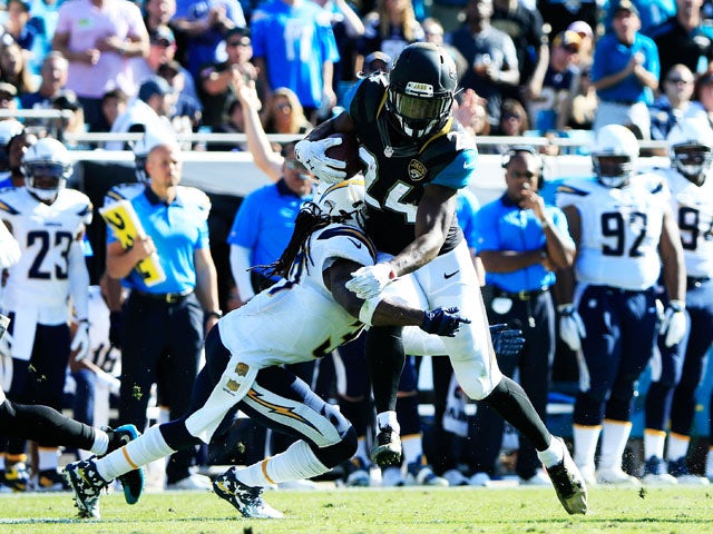 T.J. Yeldon #24 of the Jacksonville Jaguars is tackled by Jahleel Addae #37 of the San Diego Chargers in the second quarter at EverBank Field on November 29, 2015