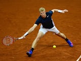 Kyle Edmund of Great Britain hits a forehand during the singles match against David Goffin of Belgium on day one of the Davis Cup Final 2015 at Flanders Expo on November 27, 2015 in Ghent, Belgium.