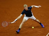 Kyle Edmund of Great Britain hits a forehand during the singles match against David Goffin of Belgium on day one of the Davis Cup Final 2015 at Flanders Expo on November 27, 2015 in Ghent, Belgium.
