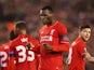 Christian Benteke of Liverpool celebrates as he scores their second goal during the UEFA Europa League Group B match between Liverpool FC and FC Girondins de Bordeaux at Anfield on November 26, 2015 in Liverpool, United Kingdom.