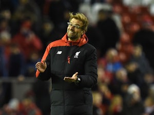 Liverpool's German manager Jurgen Klopp applauds, on the pitch after the English Premier League football match between Liverpool and Swansea City at the Anfield stadium in Liverpool, north-west England on November 29, 2015