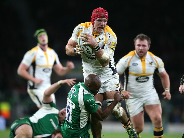 James Haskell of Wasps is tackled by Topsy Ojo during the Aviva Premiership match between London Irish and Wasps at Twickenham Stadium on November 28, 2015 in London, England.