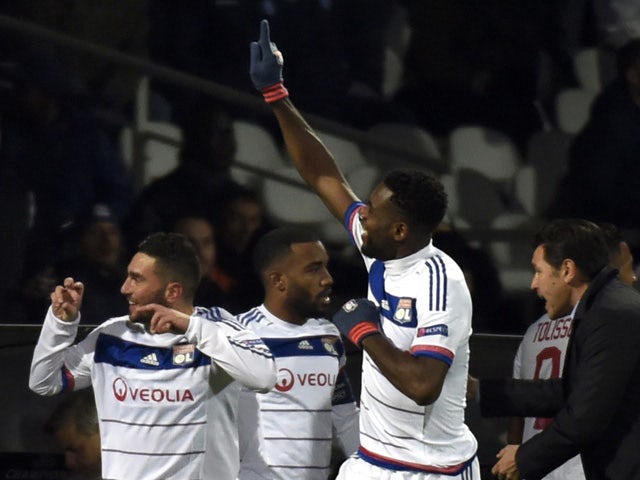 Lyon's French midfielder Jordan Ferri (L) celebrates with teammates after scoring a goal during the UEFA Champions League group H football match between Lyon and Gent on November 24, 2015