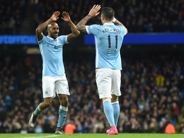Manchester City's Serbian defender Aleksandar Kolarov (R) celebrates with Manchester City's English midfielder Fabian Delph after scoring during the English Premier League football match between Manchester City and Southampton at The Etihad stadium in Man