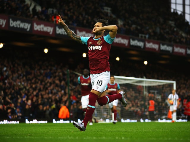 Mauro Zarate of West Ham United celebrates as he scores their first goal from a free kick during the Barclays Premier League match between West Ham United and West Bromwich Albion at Boleyn Ground on November 29, 2015 in London, England.