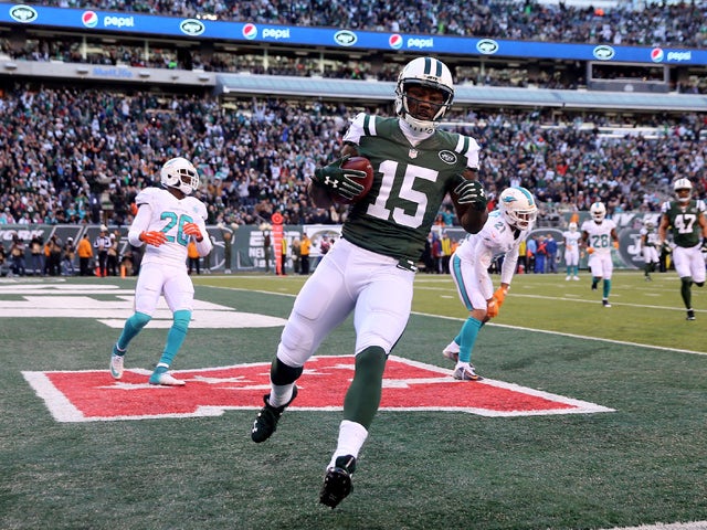Brandon Marshall #15 of the New York Jets celebrates his touchdown in the first quarter against the Miami Dolphins on November 29, 2015