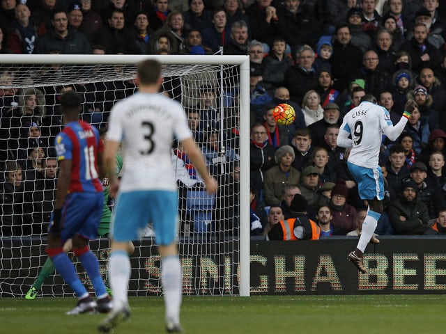 Newcastle United's Senegalese striker Papiss Cisse (R) heads the ball to score his team's first goal during the English Premier League football match between Crystal Palace and Newcastle United at Selhurst Park in south London on November 28, 2015