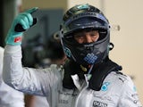 Mercedes AMG Petronas F1 Team's German driver Nico Rosberg celebrates after the qualifying session at the Yas Marina circuit in Abu Dhabi on November 28, 2015