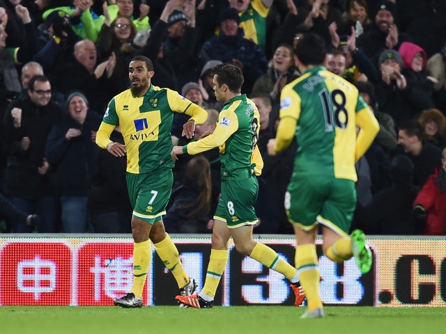 Lewis Grabban of Norwich City (7) celebrates with Jonathan Howson (8) as he scores their first and equalising goal during the Barclays Premier League match between Norwich City and Arsenal at Carrow Road on November 29, 2015