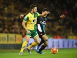 Robbie Brady of Norwich City takes on Hector Bellerin of Arsenal during the Barclays Premier League match between Norwich City and Arsenal at Carrow Road on November 29, 2015 in Norwich, England. 
