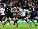 Steven Fletcher (C) of Sunderland competes for the ball against Ryan Shawcross (L) and Glenn Whelan (R) of Stoke City during the Barclays Premier League match between Sunderland and Stoke City at Stadium of Light on November 28, 2015