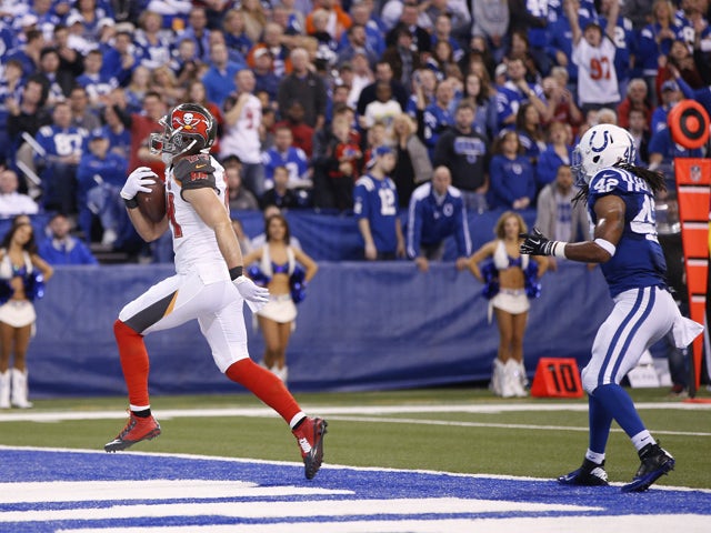 Cameron Brate #84 of the Tampa Bay Buccaneers runs into the end zone with a 20-yard touchdown reception against the Indianapolis Colts in the second quarter of the game at Lucas Oil Stadium on November 29, 2015