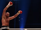 British Tyson Fury celebrates after the WBA, IBF, WBO and IBO title bout against Ukrainian world heavyweight boxing champion Wladimir Klitschko in Duesseldorf, western Germany, on November 28, 2015. Fury won the fight after 12 Rounds of Boxing.