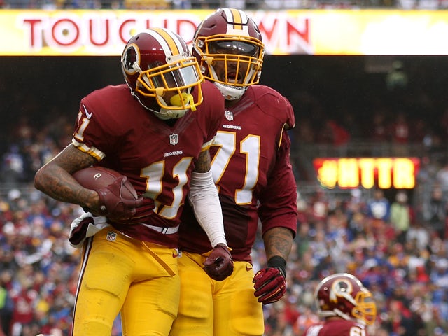 Wide receiver DeSean Jackson #11 of the Washington Redskins celebrates with tackle Trent Williams #71 after scoring a second quarter touchdown against the New York Giants at FedExField on November 29, 2015