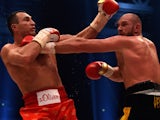 World heavyweight boxing champion Wladimir Klitschko (L) of Ukraine defends against Britain's Tyson Fury during their WBA, IBF, WBO and IBO title bout in Duesseldorf, western Germany, on November 28, 2015. Fury dethroned Klitschko in a 12round decision to