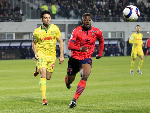 Ajaccio's French forward Kevin Mayi (R) vies with Nantes' French midfielder Jordan Veretout during the French L1 football match Gazelec Ajaccio (GFCA) against Nantes (FCN) on December 5, 2015, at the Ange Casanova stadium in Ajaccio, on the French Mediter