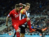 Alberto Moreno of Liverpool and Siem de Jong of Newcastle United challenge for the ball during the Barclays Premier League match between Newcastle United and Liverpool at St James' Park on December 6, 2015 in Newcastle upon Tyne, 