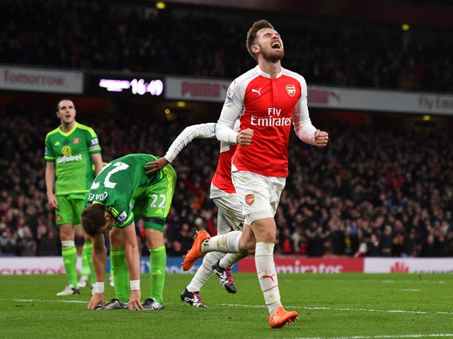 Aaron Ramsey of Arsenal celebrates scoring his team's third goal during the Barclays Premier League match between Arsenal and Sunderland at Emirates Stadiumon December 5, 2015